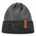 Grey knitted kids beanie with charcoal mélange turn-up cuff and Space Adventure tag – front view