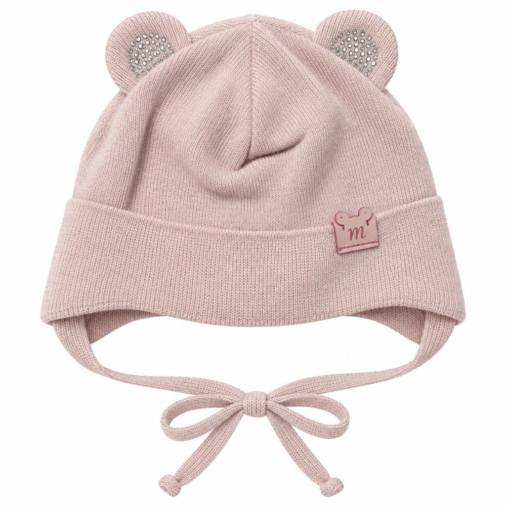 Dusty pink knitted baby girl cap with sparkly round ears, little m patch on the cuff and tie strings – front view