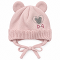 Dusty pink knitted baby girl cap with round ears, rhinestone heart, pearl bow and tie strings – front view