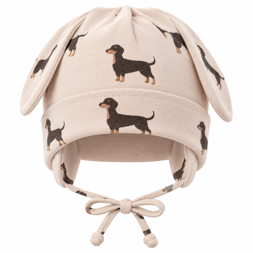 Baby cap with puppy ears and dachshund print in beige – front product shot by MINIX Switzerland