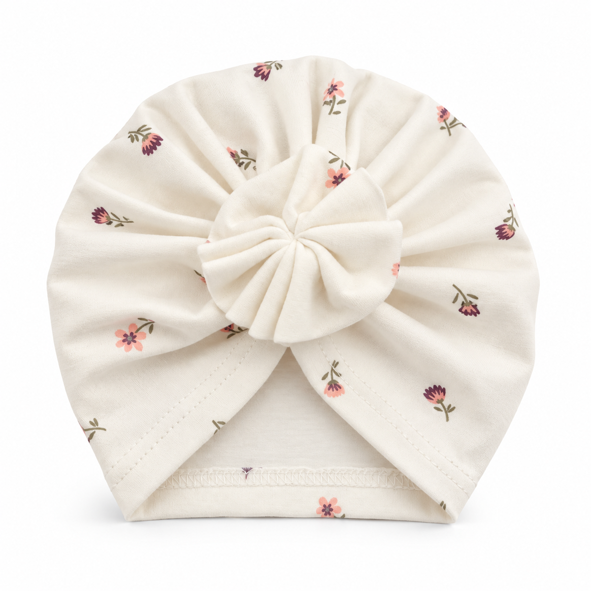 Girls cream cotton turban cap with ditsy floral print and pleated bow – flat lay product shot by MINIX Switzerland