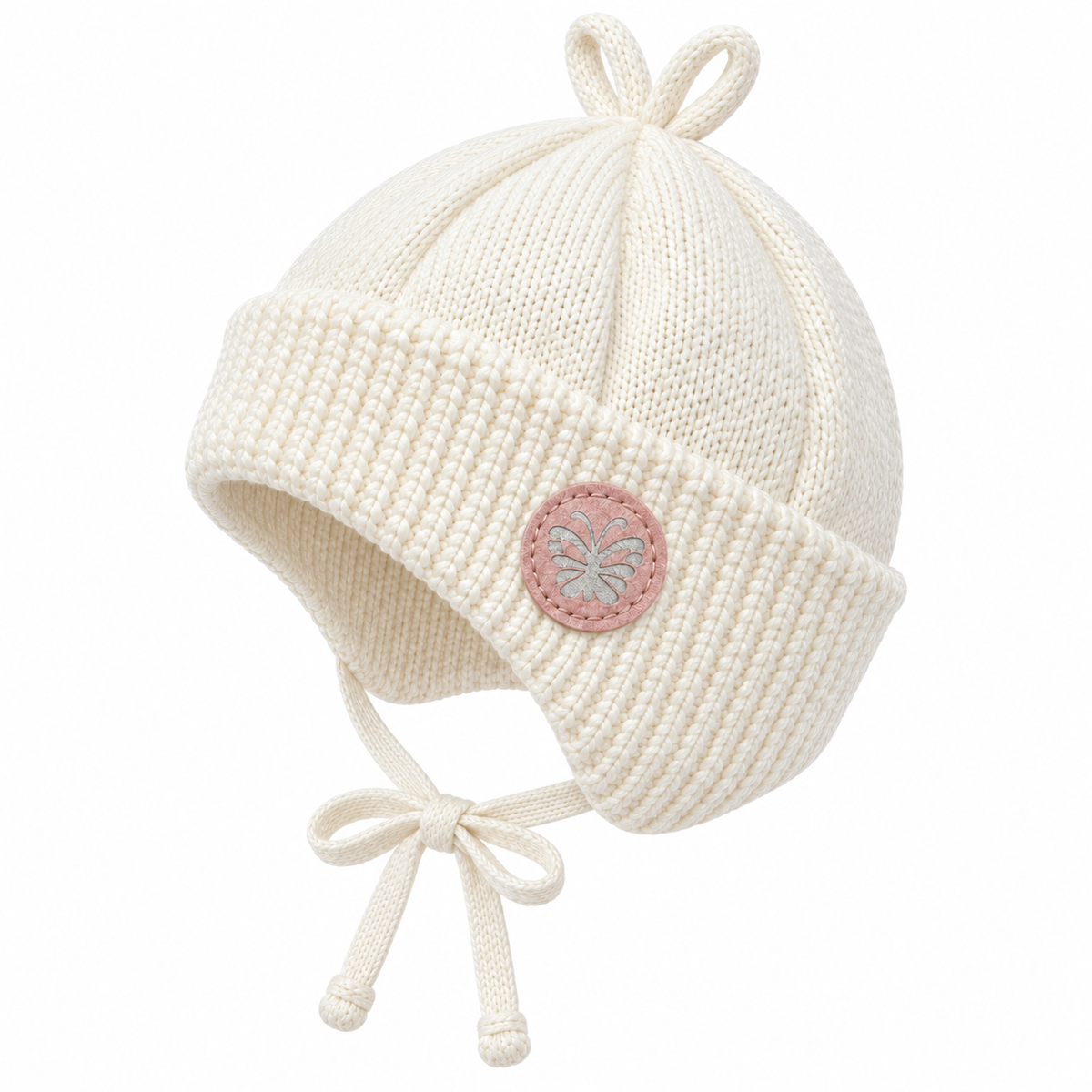 Cream knitted baby cap with butterfly patch, ear flaps and ties – side view