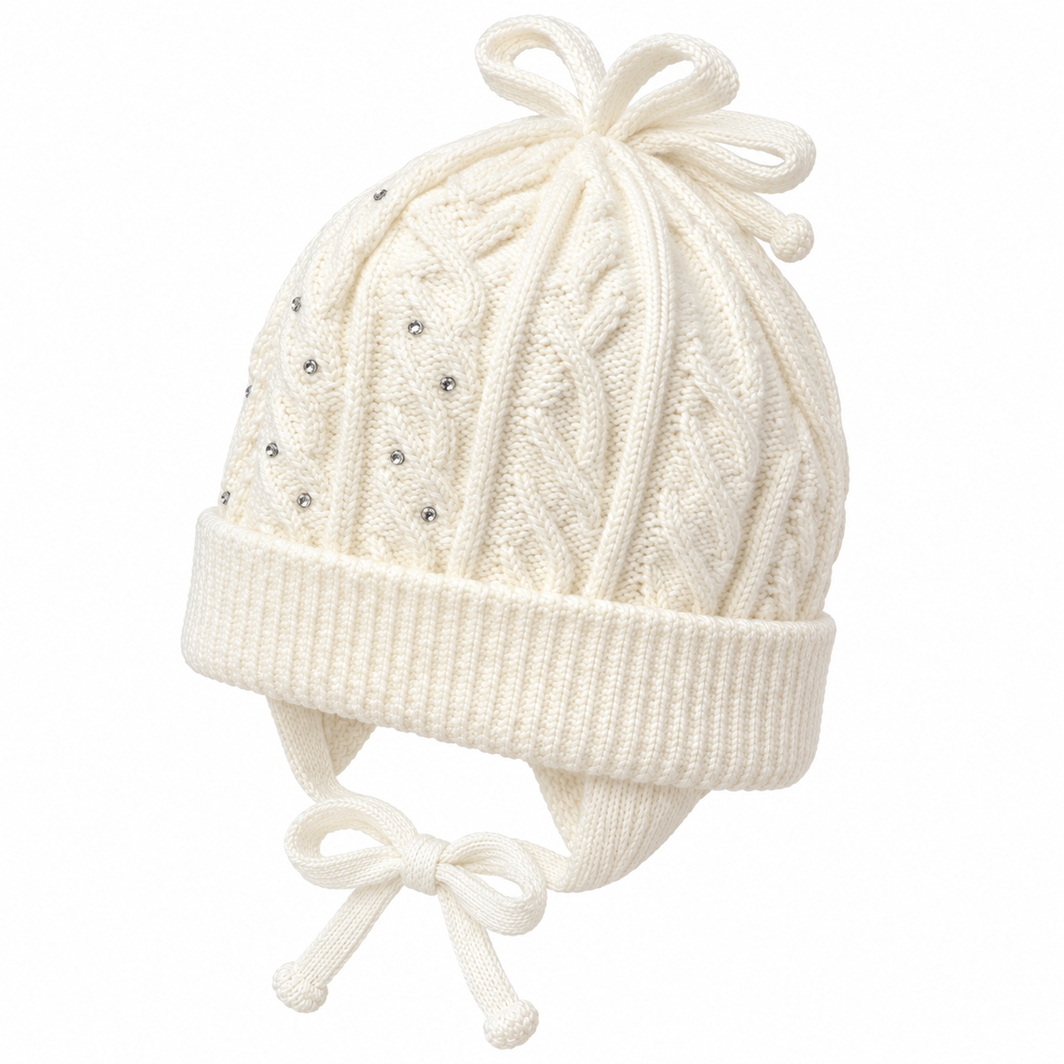 Close-up of the cable knit, rhinestones and knitted bow on a cream baby girl cap