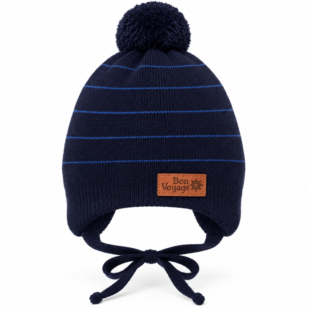 Navy striped knit baby boy cap with pompom, Bon Voyage patch, ear flaps and tie strings – front view