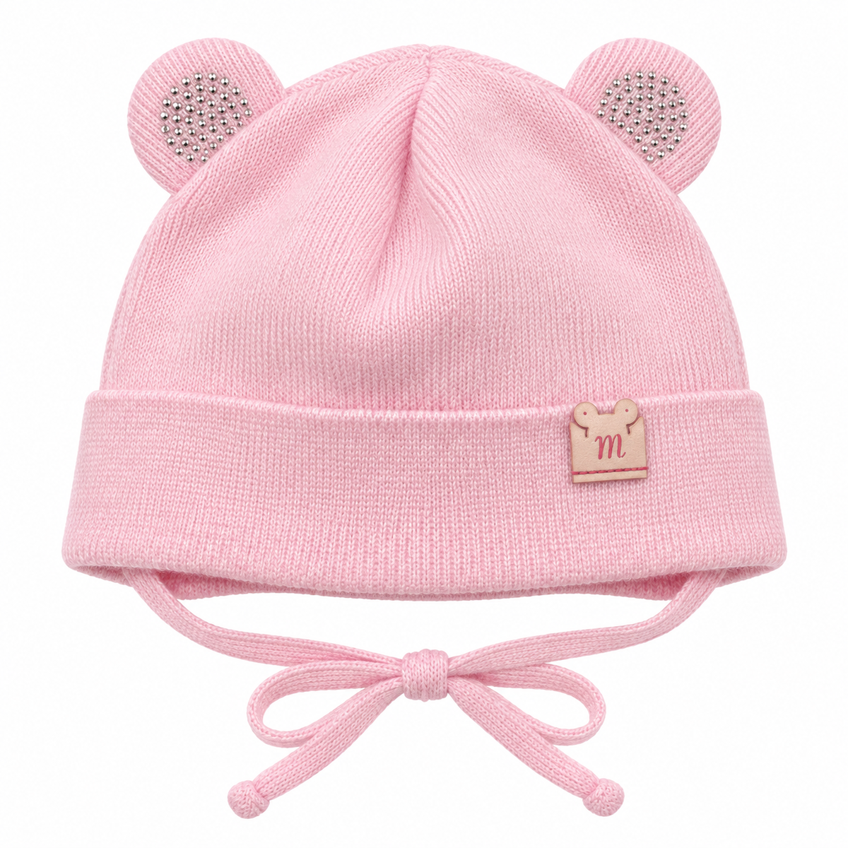 Pink knitted baby girl cap with sparkly round ears, little m patch on the cuff and tie strings – front view