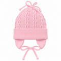 Pink wave-knit baby girl cap with knitted top ties, fold-over cuff, ear flaps and tie strings – front view